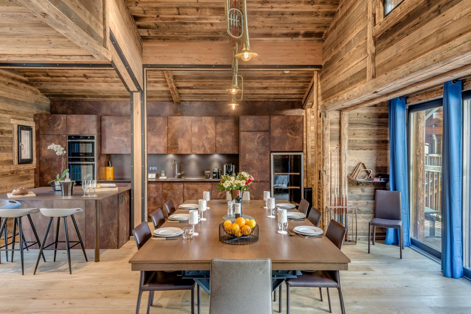 Dining area for 10 with wine fridge and adjacent island seating