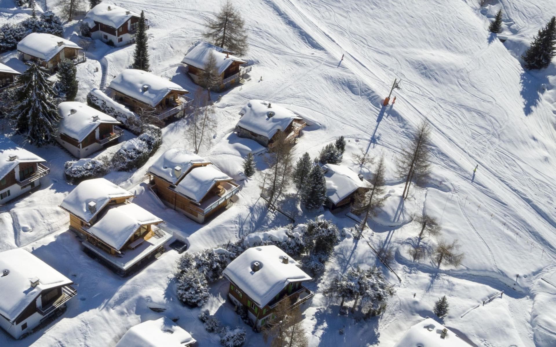 Chalet location featuring direct ski-in/ski-out access to groomed slopes