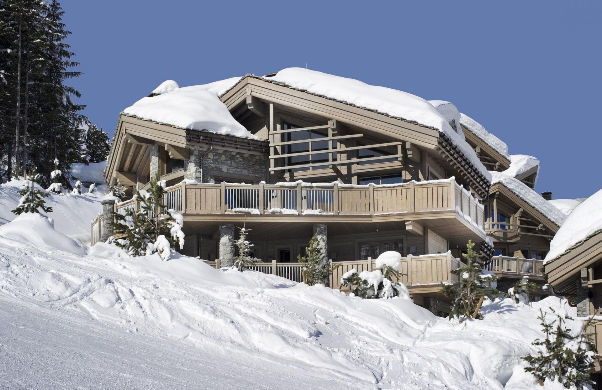 Ski-in/ski-out chalet with wrap-around decks and immediate slope access