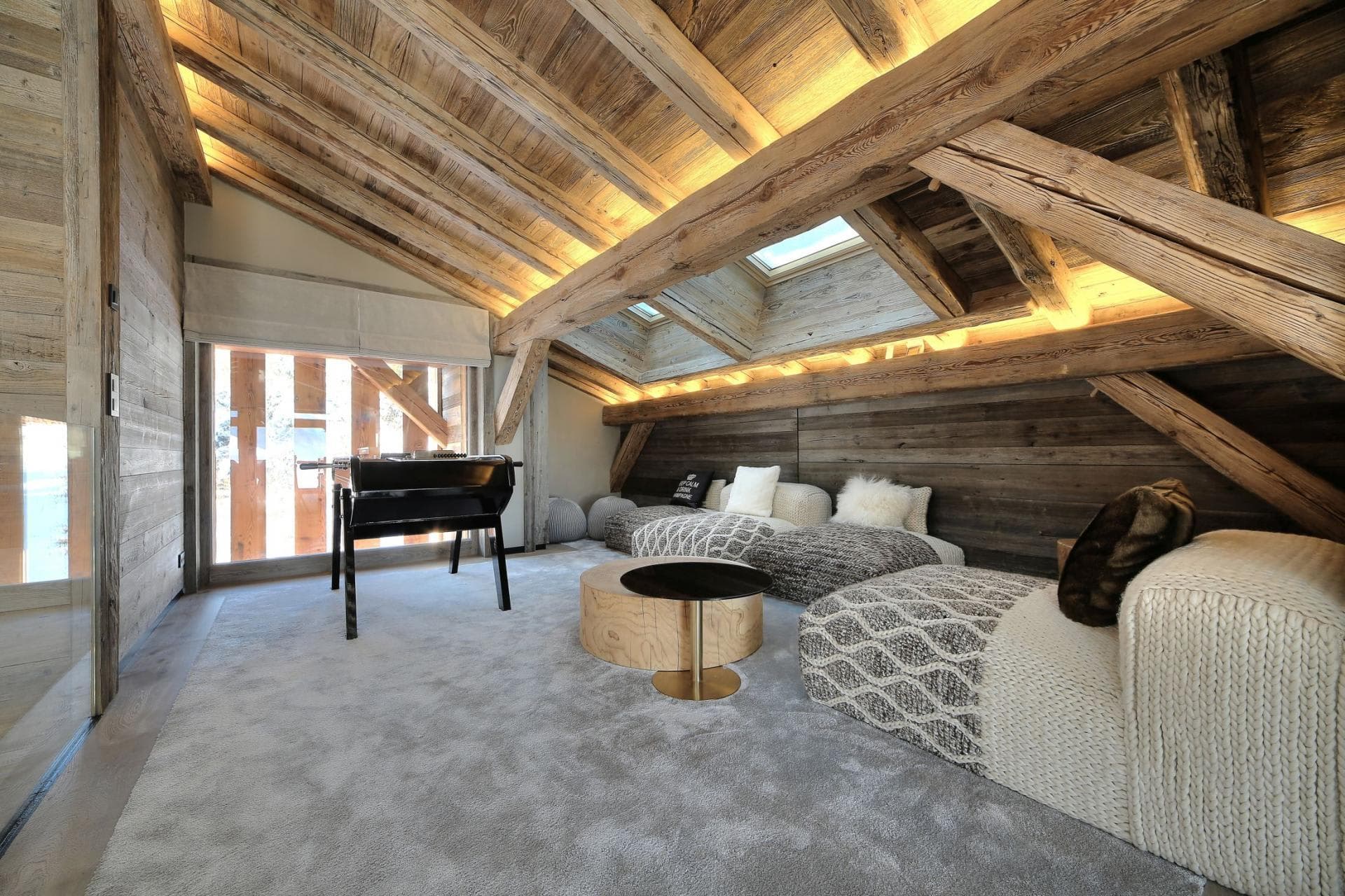 Loft game room with foosball table and skylights