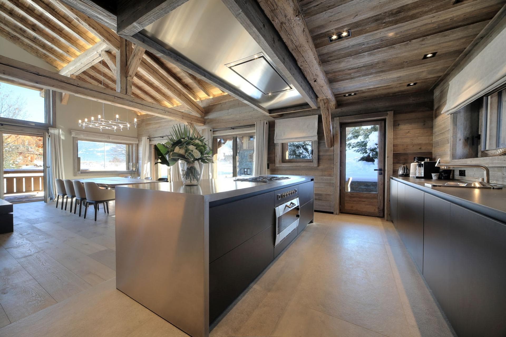 Kitchen with stainless steel island; dining table seats 8