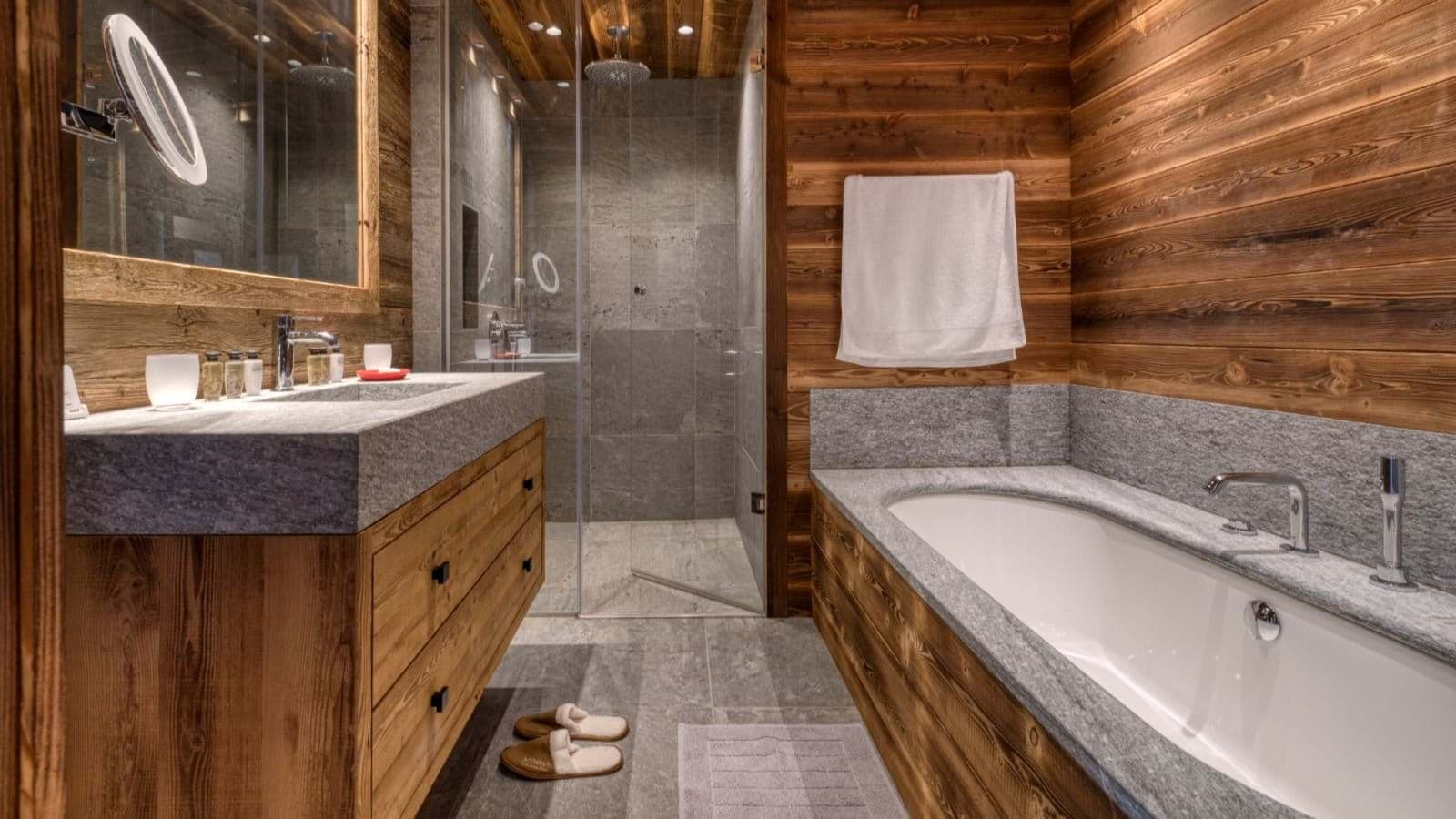 Bathroom with reclaimed wood walls, soaking tub, and walk-in rain shower