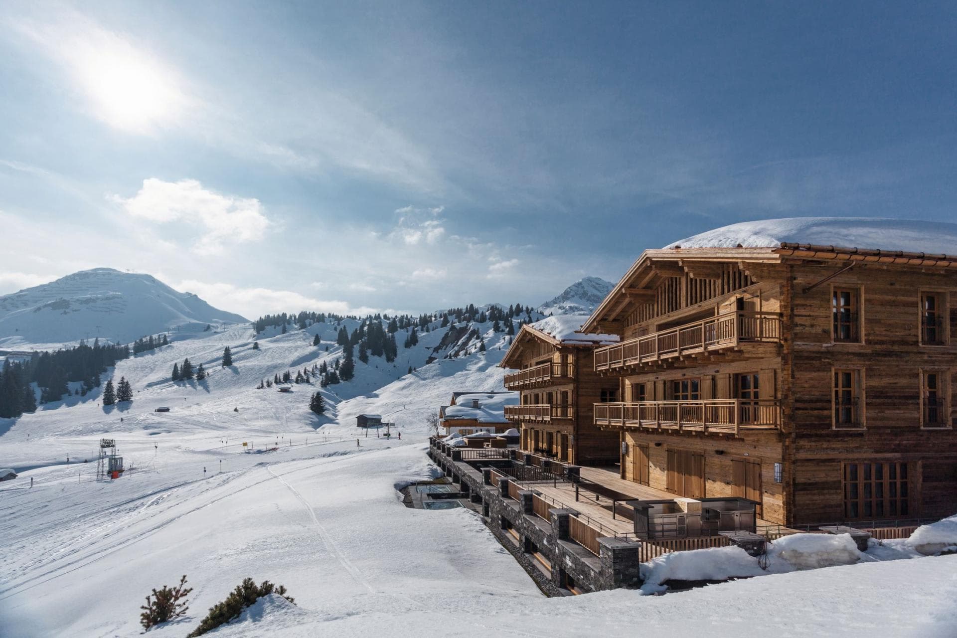 Ski-in/ski-out chalet exterior with private balconies and mountain views