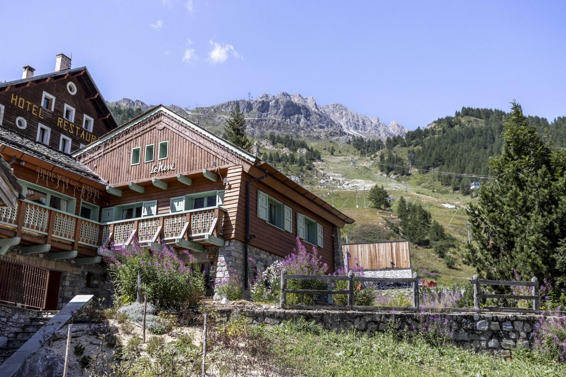 Chalet exterior with mountain views and proximity to ski gondola
