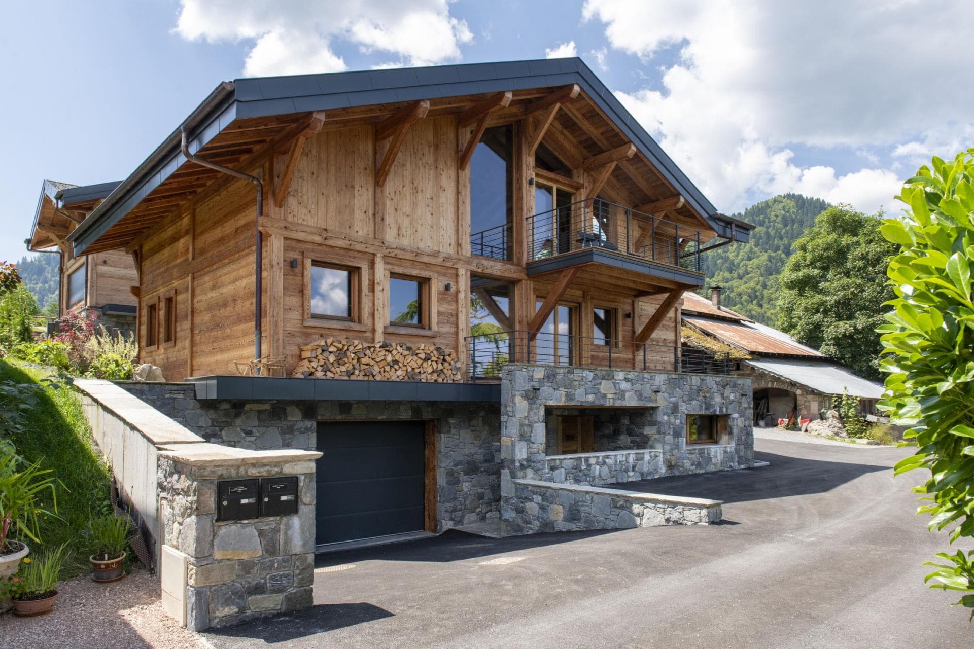 Chalet exterior with two-car garage and private driveway parking