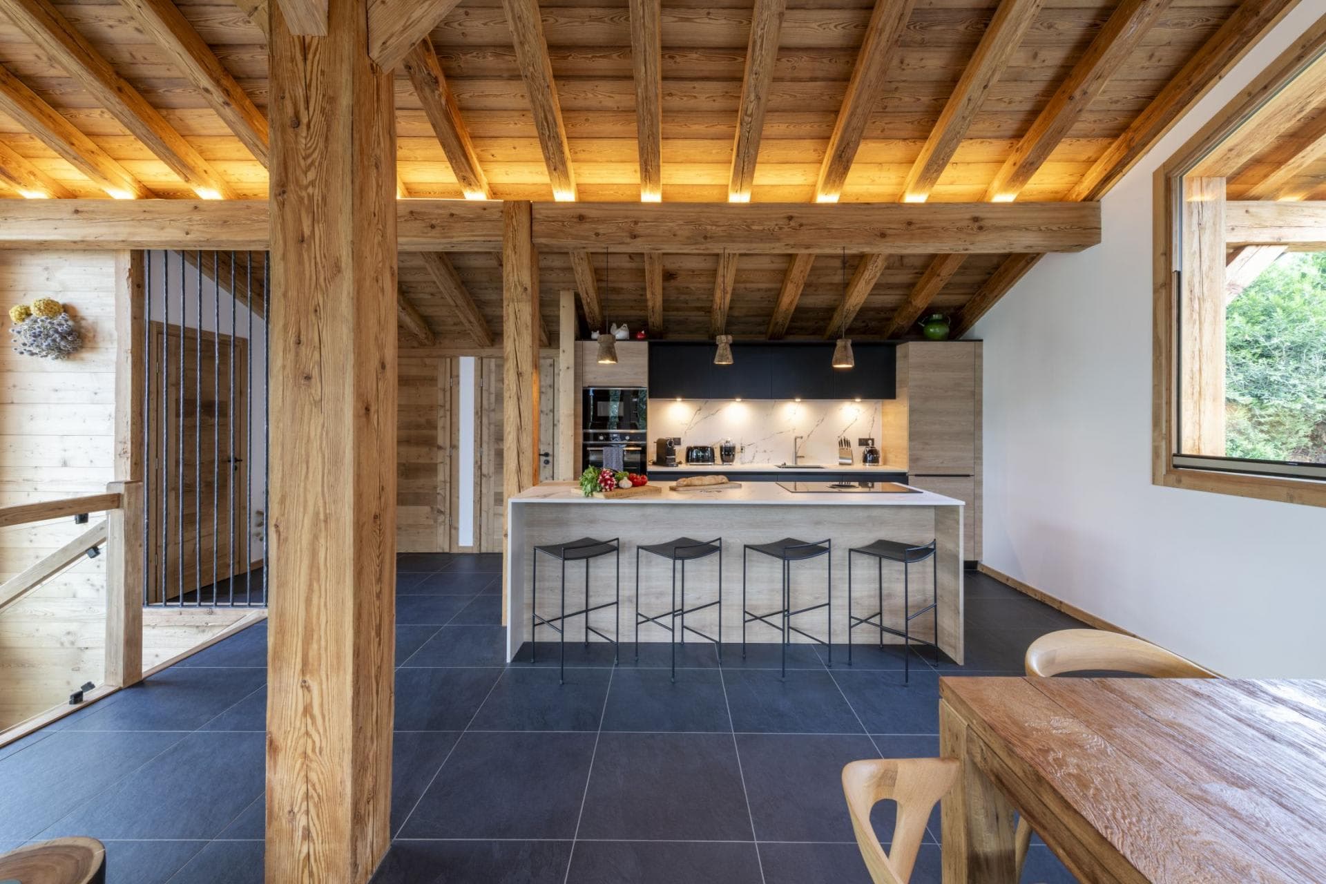 Open-concept kitchen with island seating for four and induction cooktop