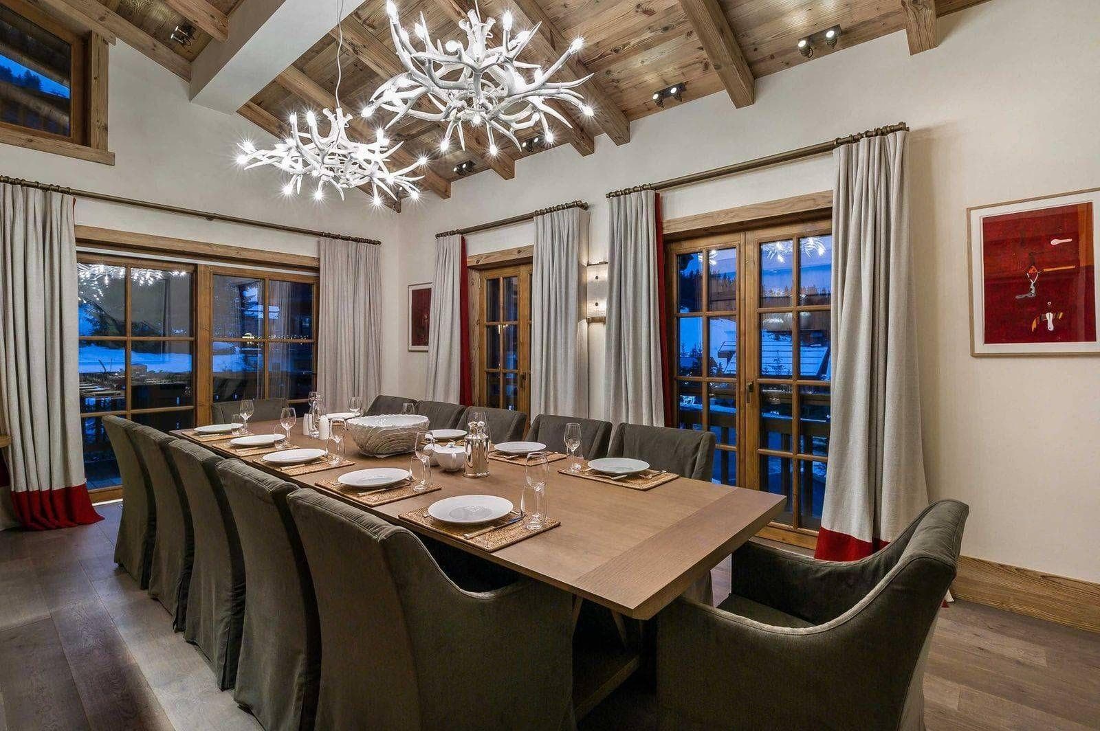 Dining room with seating for 12 and vaulted wood-beam ceiling