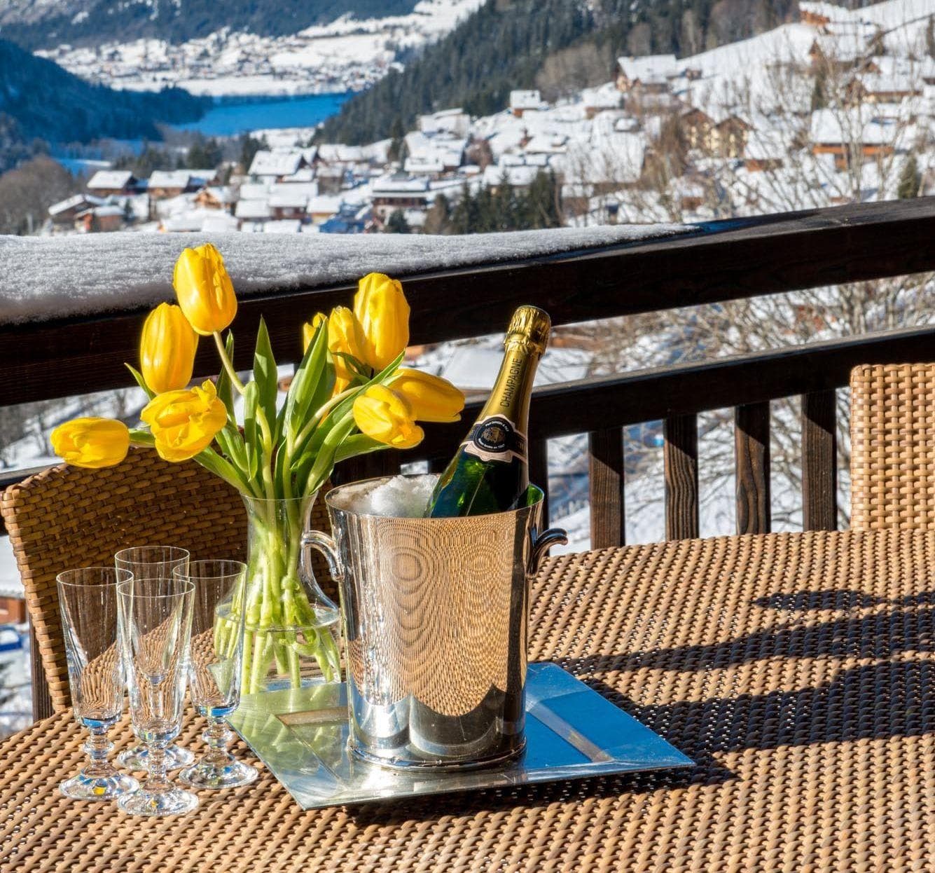 Private balcony with wicker seating and views of Morzine valley