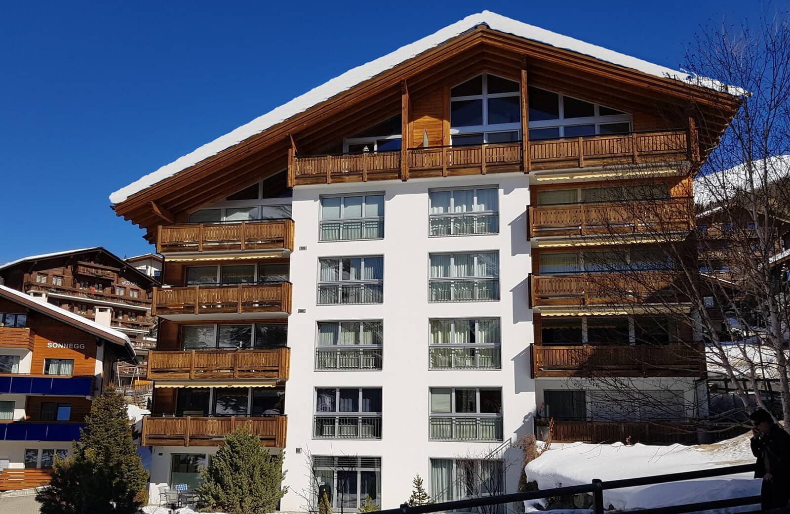 Chalet facade showing private balconies for each unit