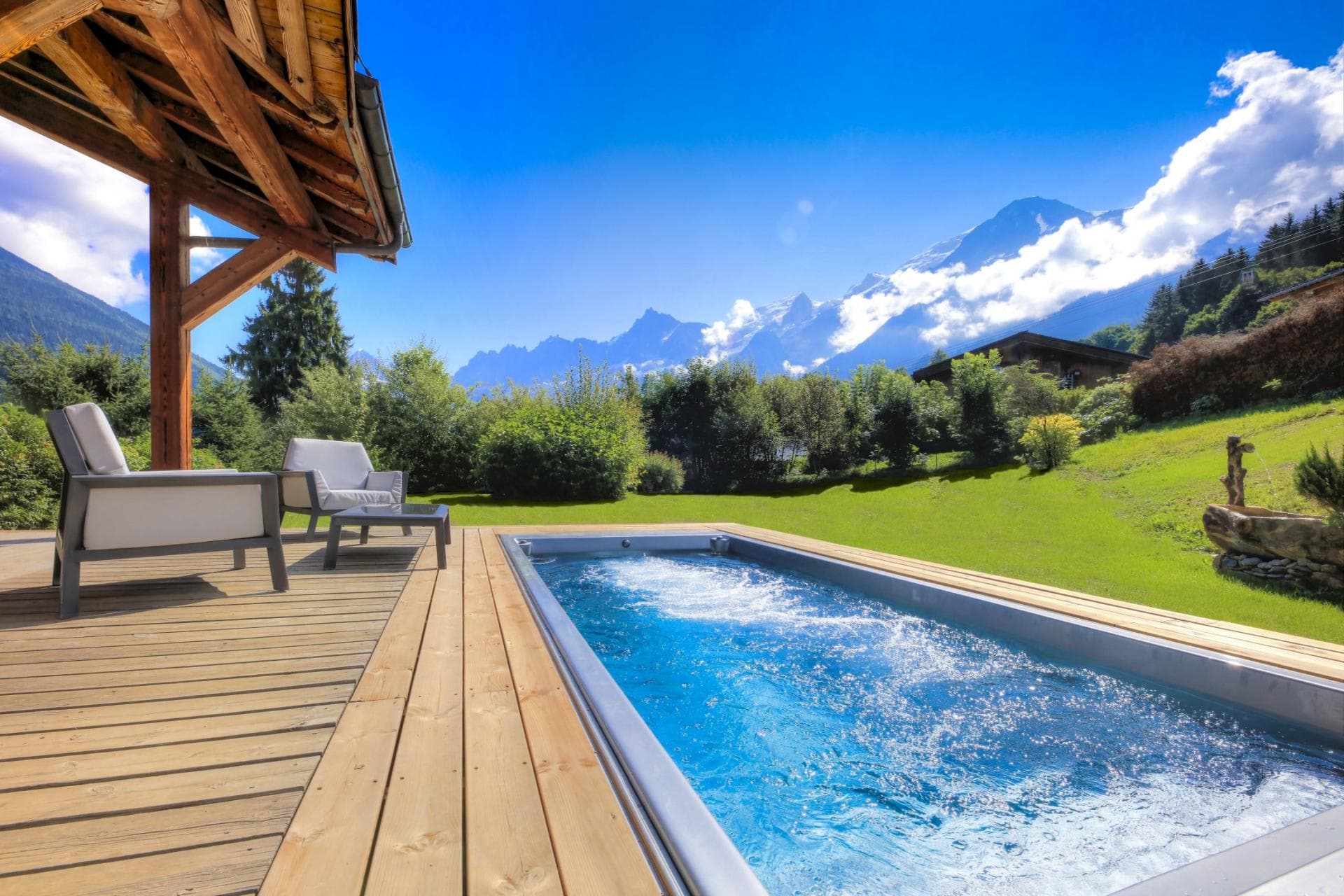 Outdoor swim spa and timber deck with Mont Blanc mountain views