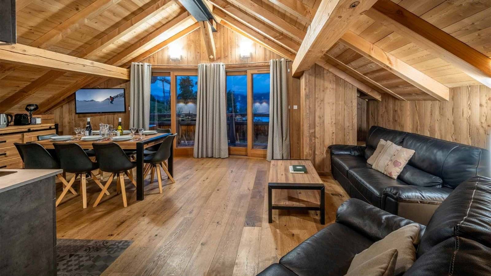 Open living area with dining for 6 and vaulted wood ceilings