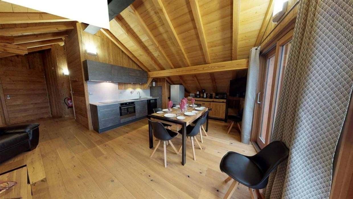 Kitchen and dining area with vaulted wood ceilings; seating for 6