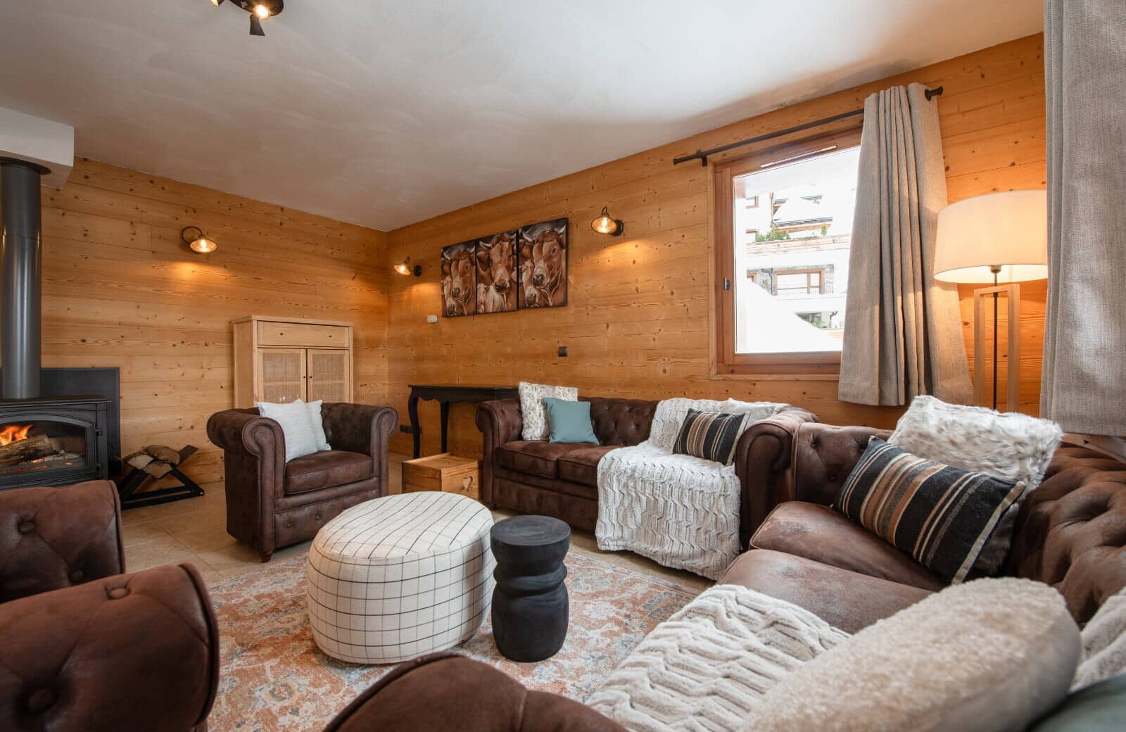 Living room with wood-burning stove and leather seating for 7