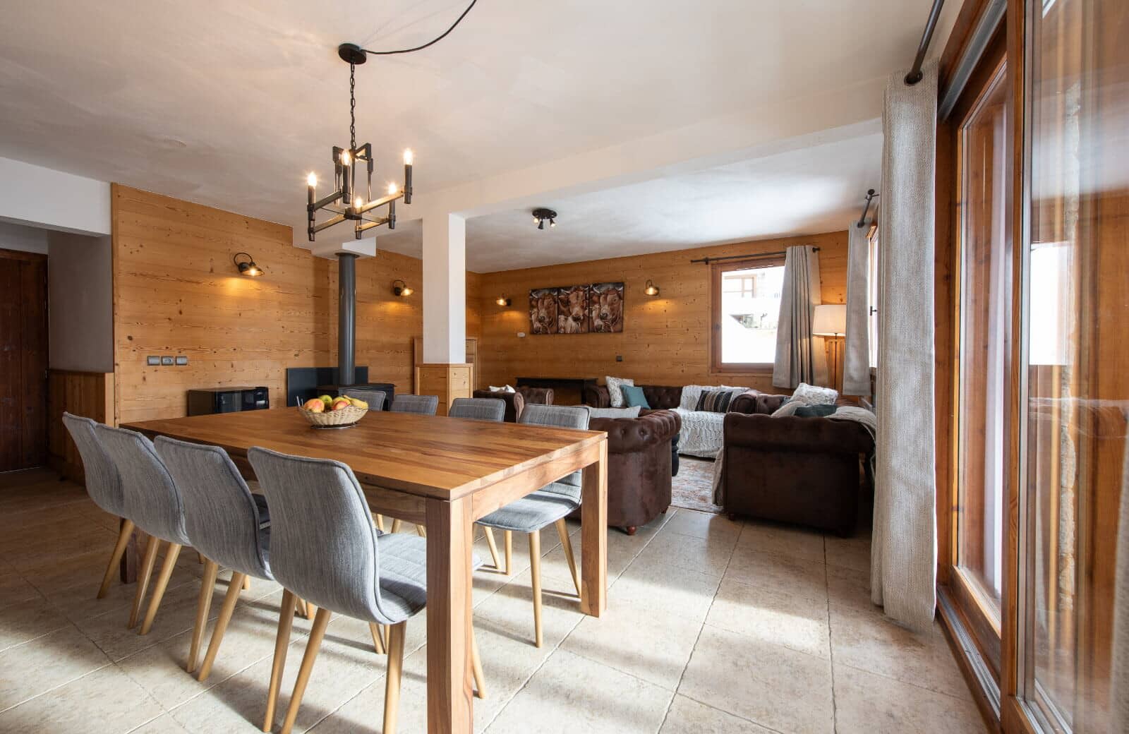 Dining table for 8 in open-plan living area with wood-burning stove