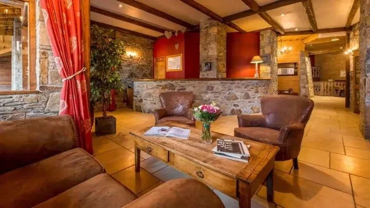 Lobby lounge with leather armchairs and reception desk