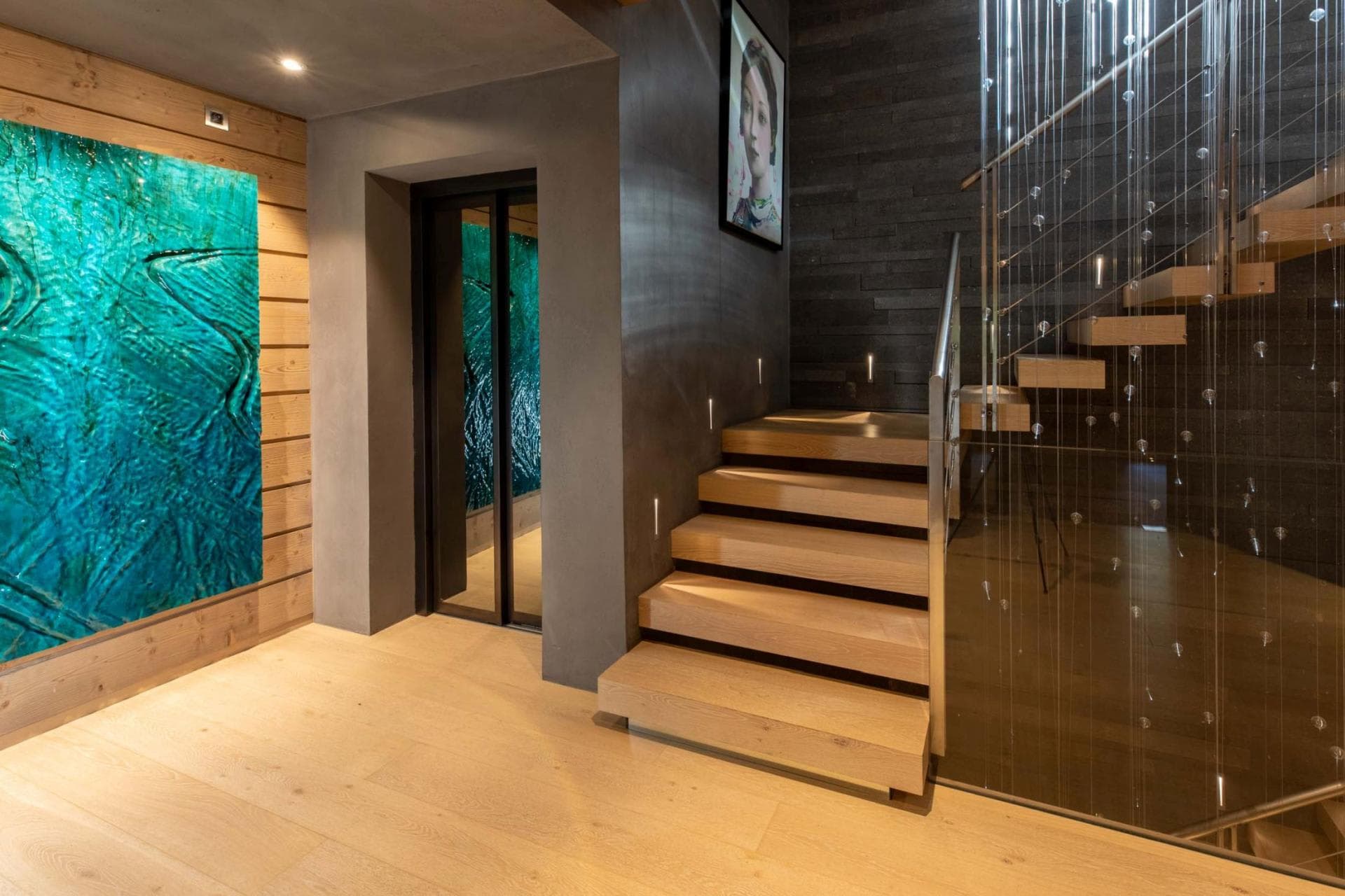 Floating wood staircase and private elevator access to all floors