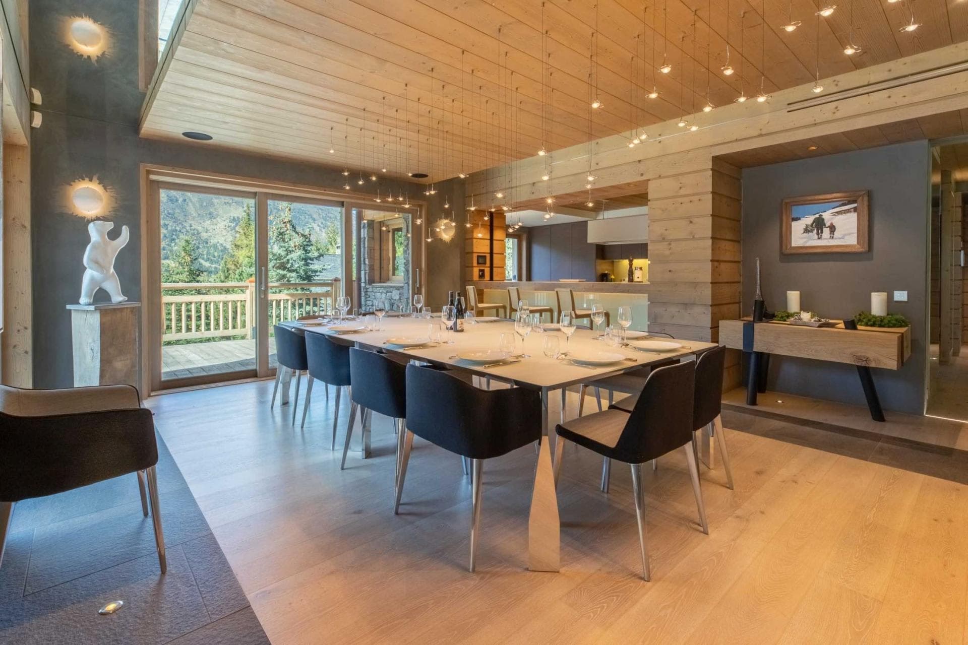 Dining table seats 12; sliding doors lead to mountain-view deck