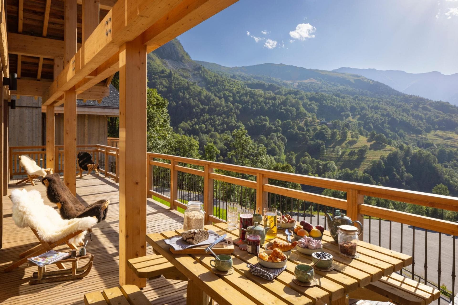 Covered timber deck with picnic table and valley views