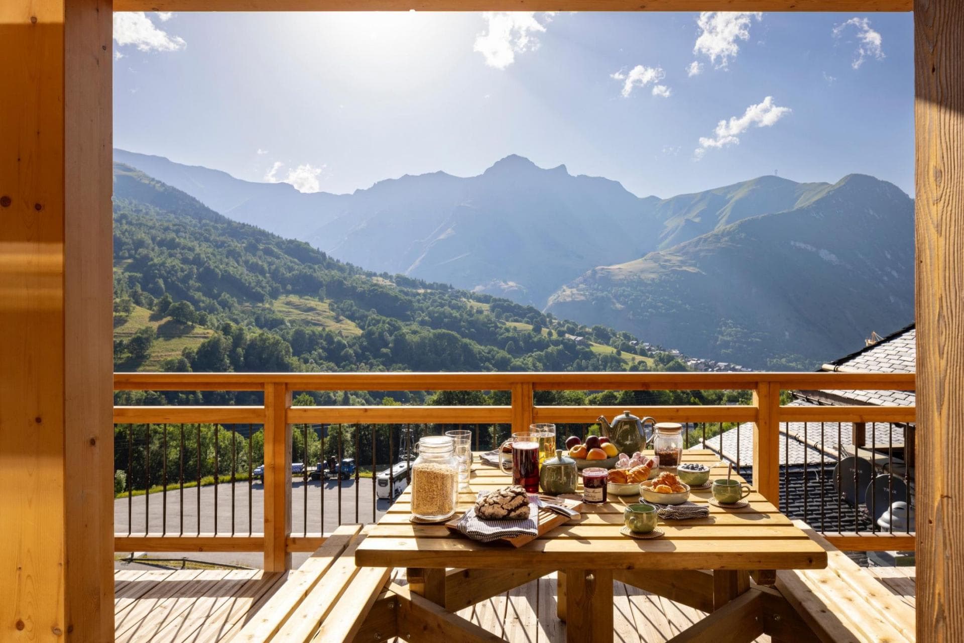 Private balcony with picnic table seating and panoramic mountain views