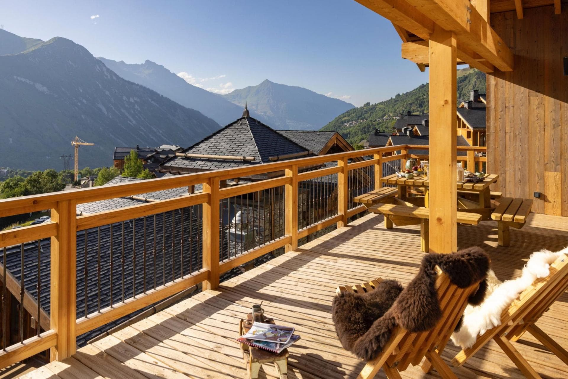 Private balcony with mountain views and picnic table seating for 6