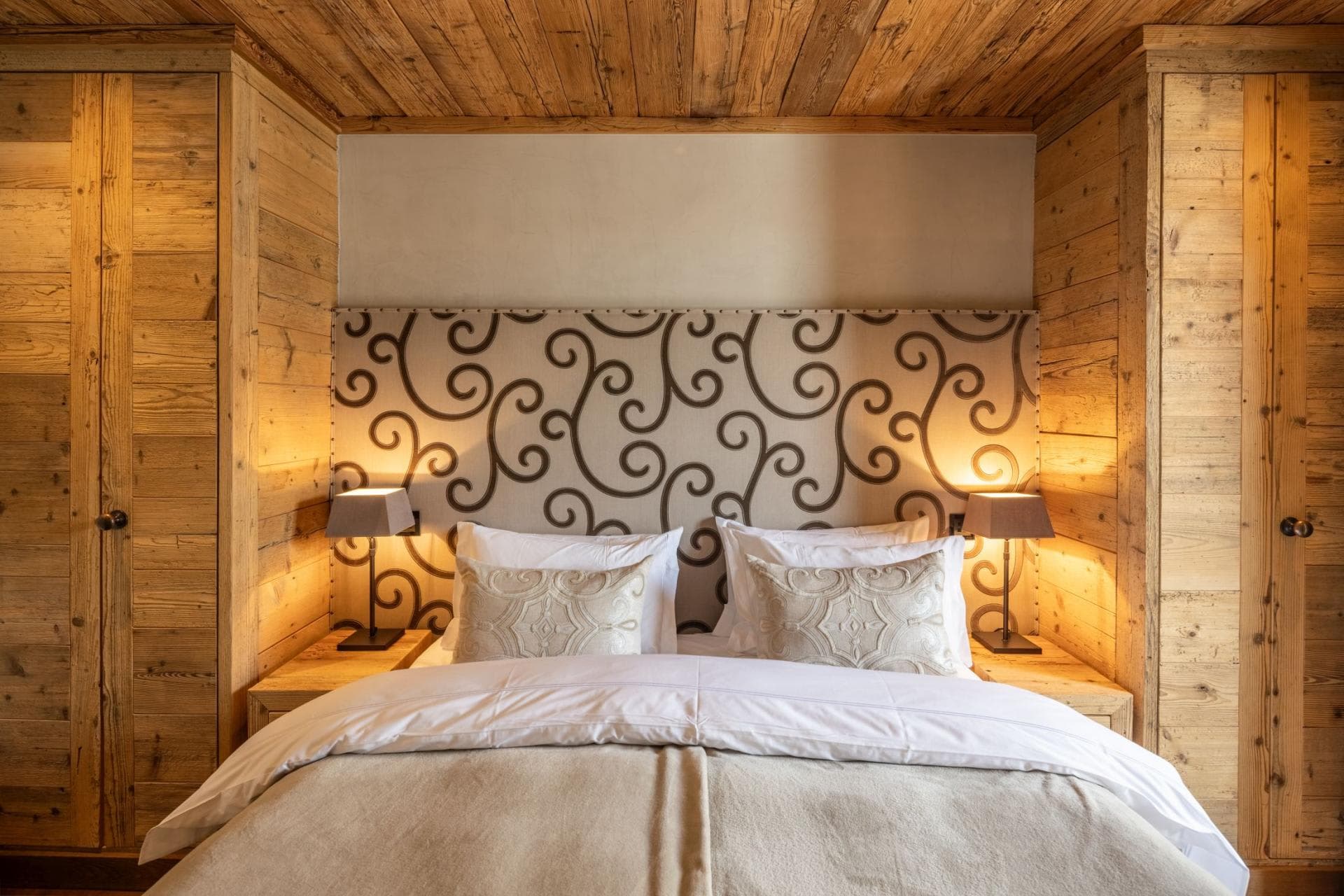 Bedroom with king bed and integrated floor-to-ceiling wardrobes