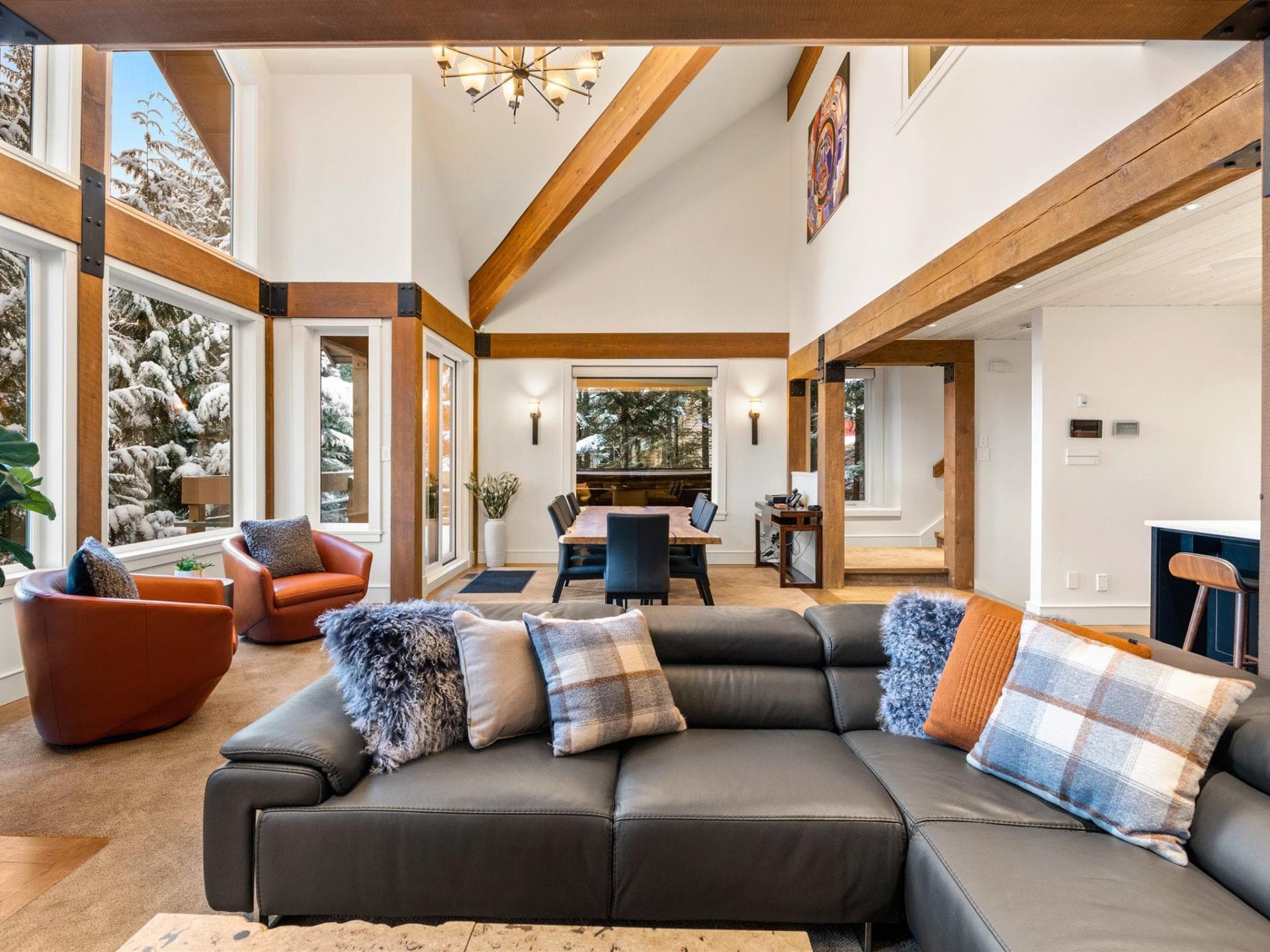 Open-plan living area with vaulted ceilings and dining for 6