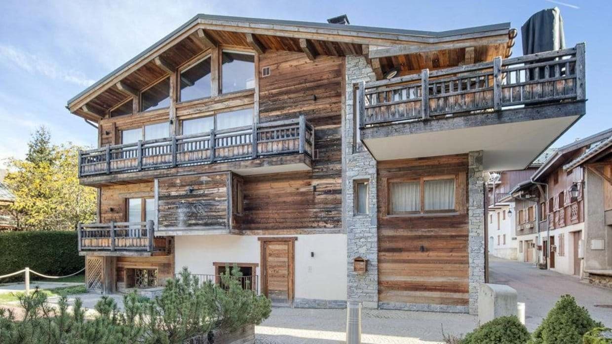 Three-story wood and stone chalet with multiple private balconies