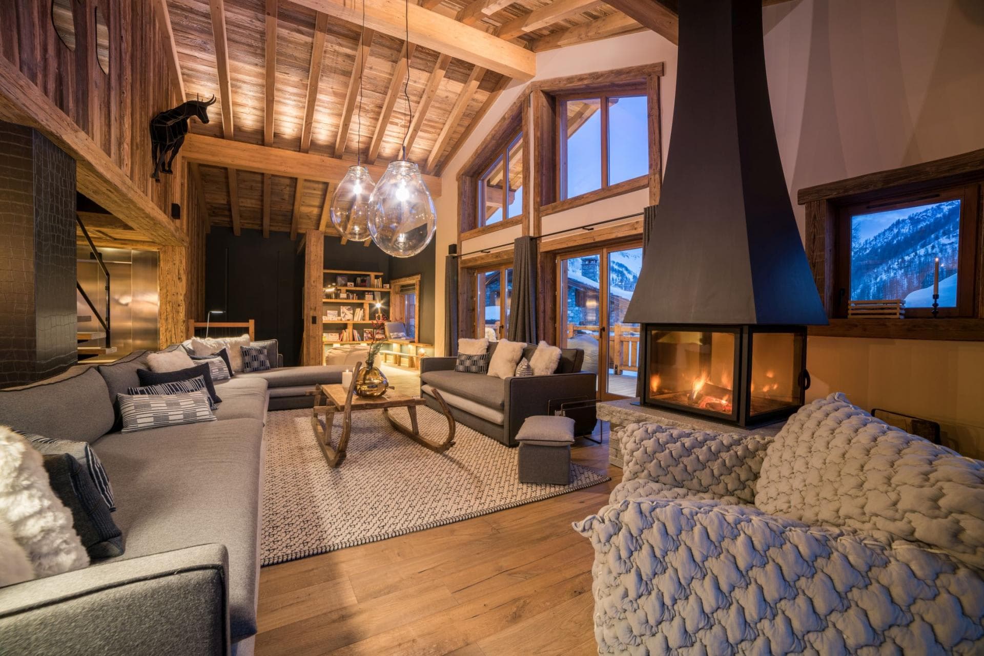 Living area with wood-burning fireplace and seating for 12 people