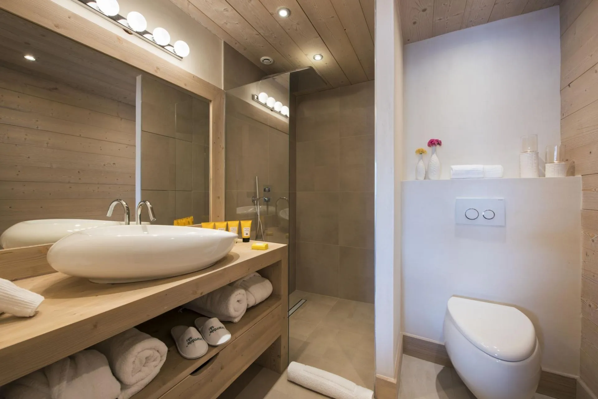 Bathroom with vessel sink and curbless walk-in shower