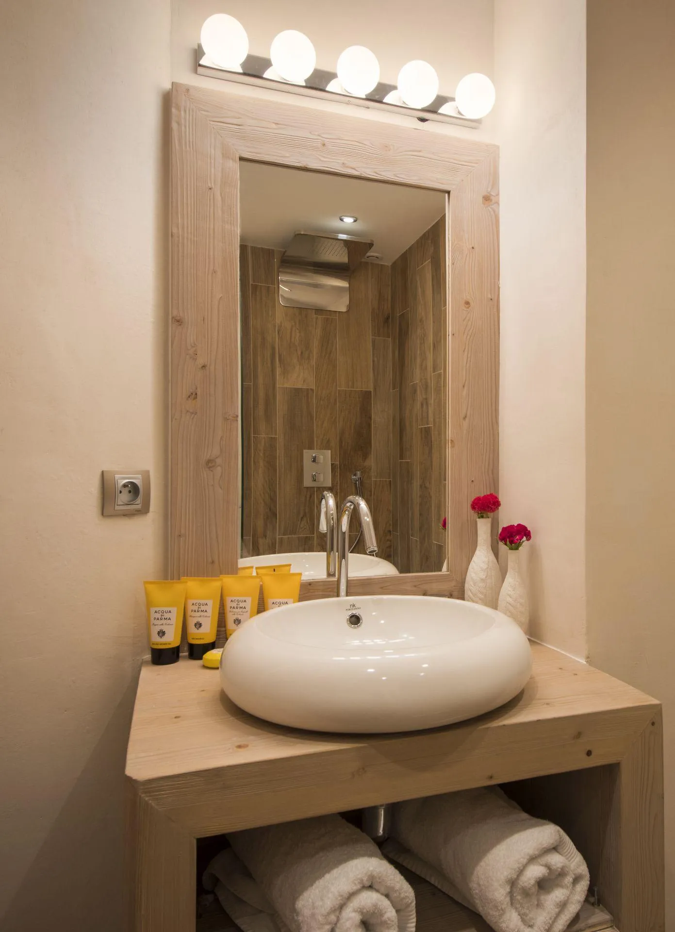 Bathroom vanity with vessel sink and walk-in rainfall shower