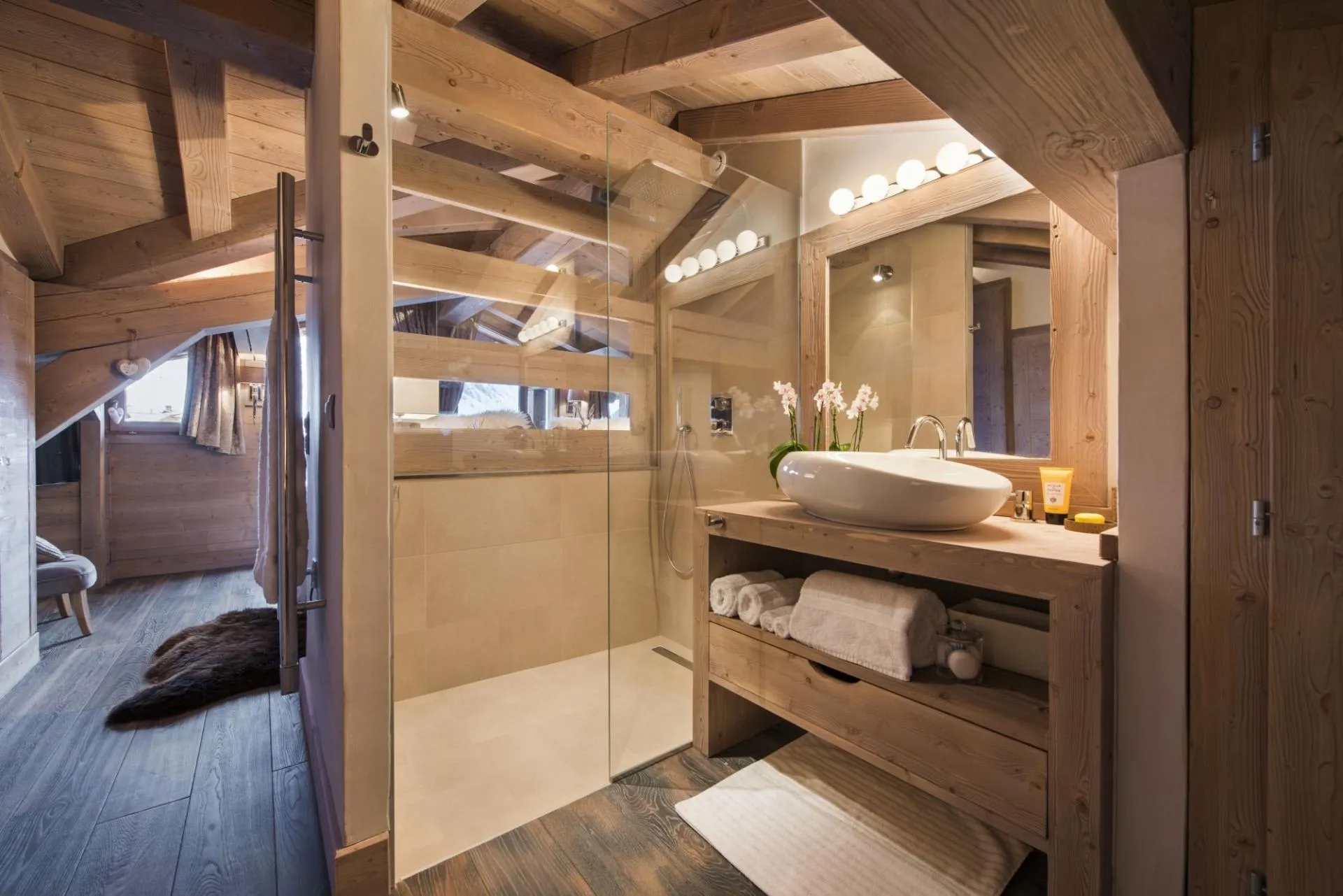 Bathroom with walk-in rainfall shower and heated towel rack