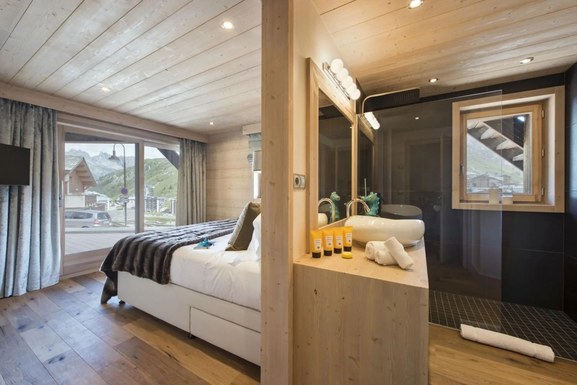 Primary bedroom and ensuite with walk-in rainfall shower and mountain views