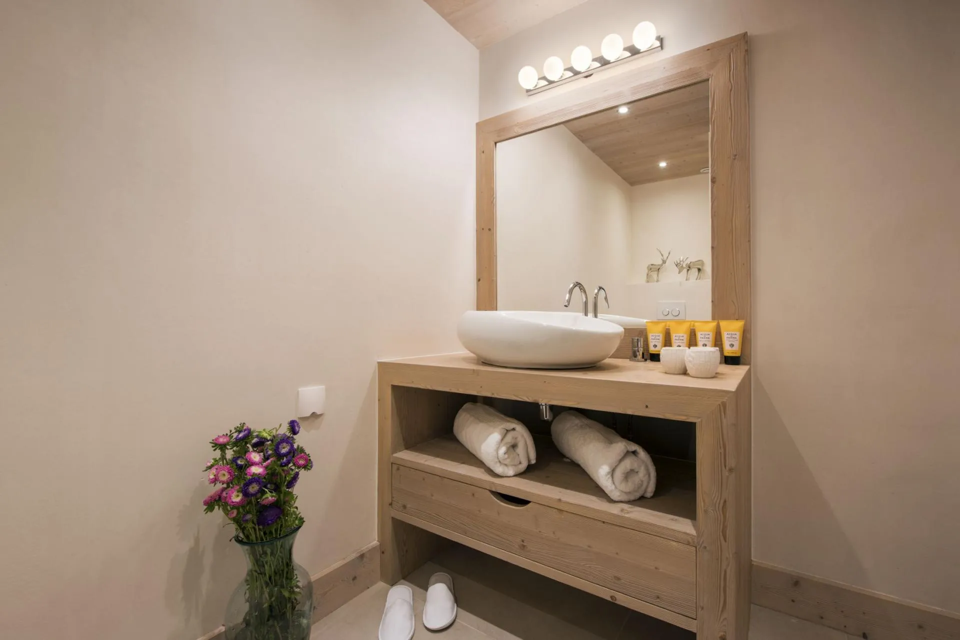 Bathroom vanity with vessel sink and wall-mounted faucet