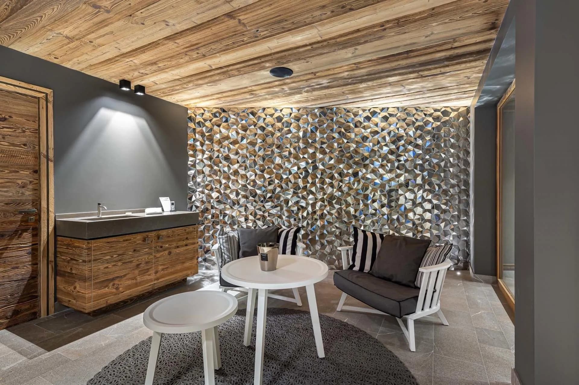Seating nook beside basin counter and mosaic wall