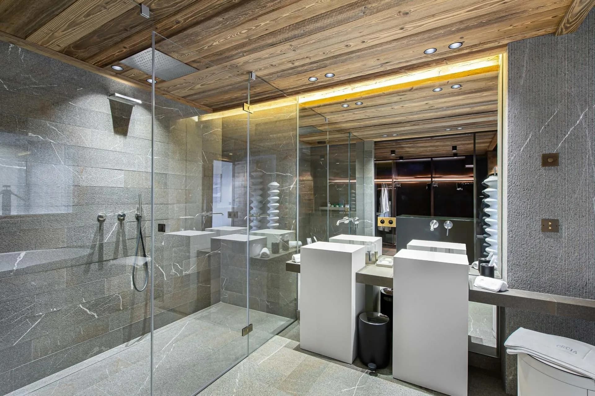 Walk-in shower and double basins with timber detailing