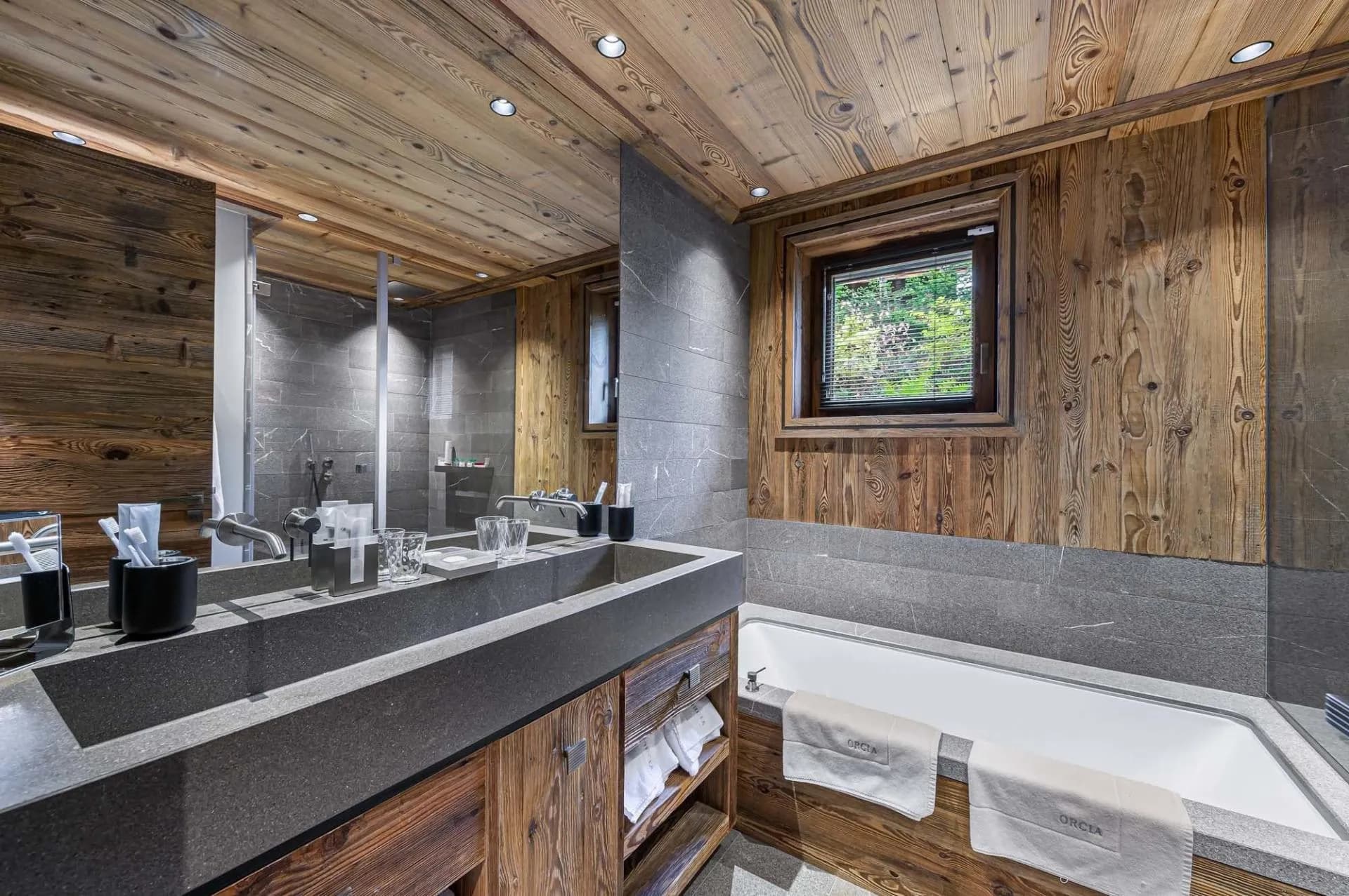 Bathroom with double basins and bathtub