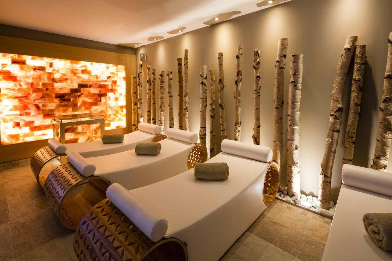 Relaxation room with back-lit Himalayan salt wall and birch accents