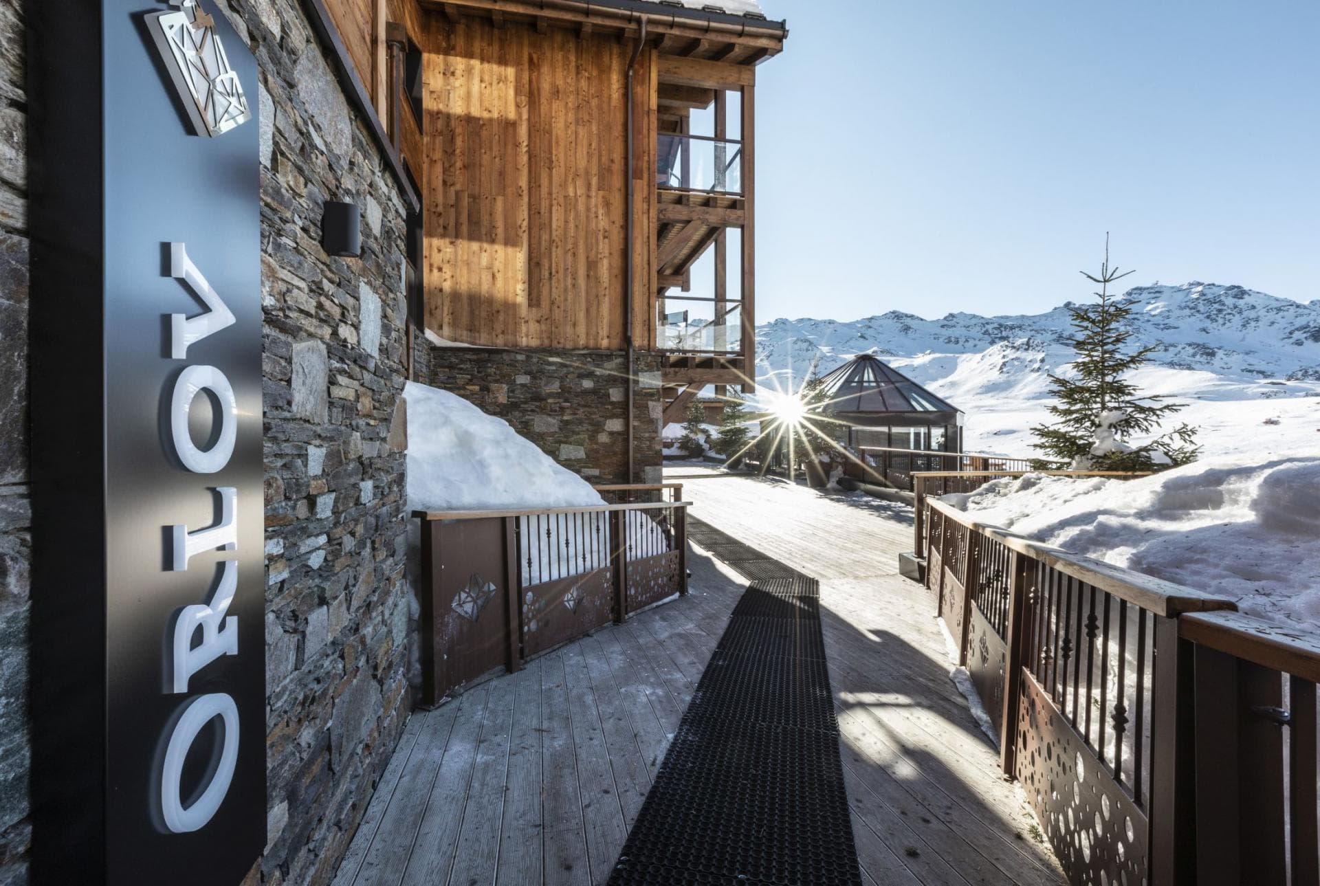 Chalet Orlov entrance featuring non-slip walkway and panoramic mountain views