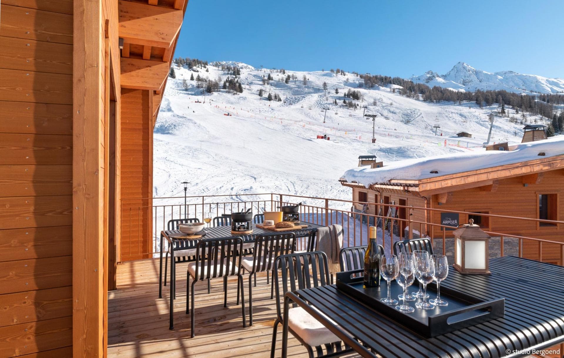 Private balcony with outdoor dining for 12 and ski-in/ski-out views