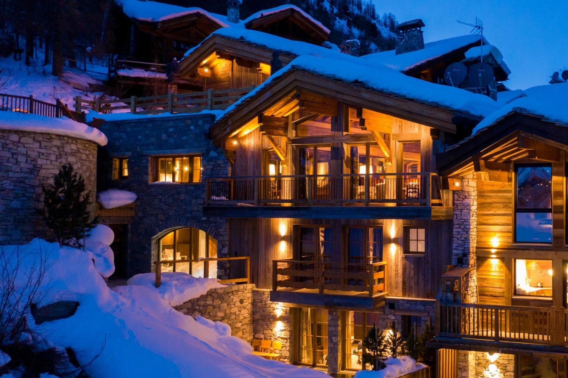 Ski-in/ski-out chalet with multi-level balconies and stone masonry
