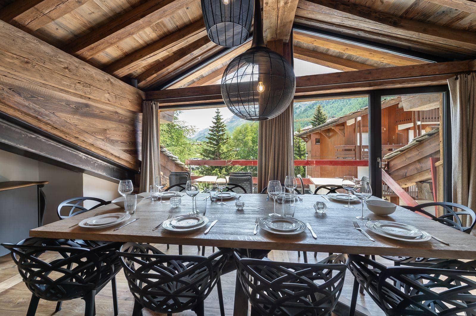Dining area under vaulted timber ceilings with seating for 10