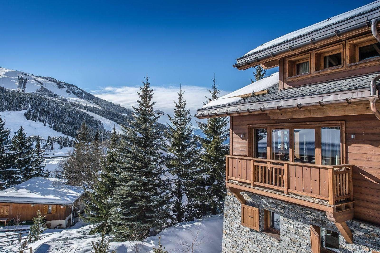 Chalet exterior with private balcony and direct views of ski slopes