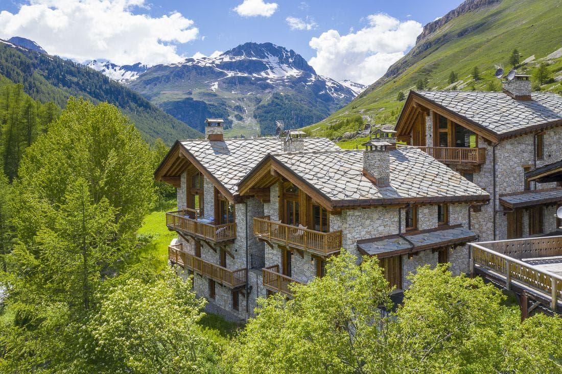 Stone-clad chalet with private balconies and panoramic mountain views