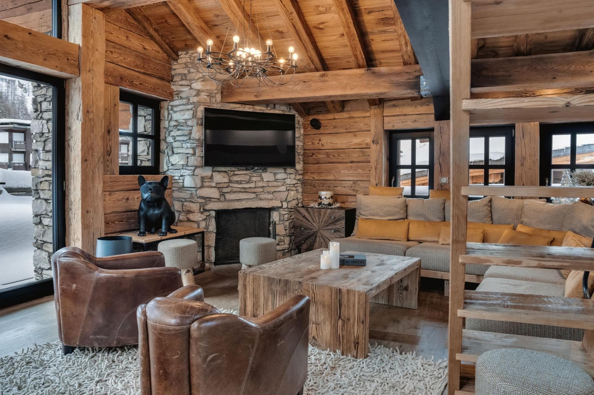 Living area with wood-burning fireplace and sectional seating for 8
