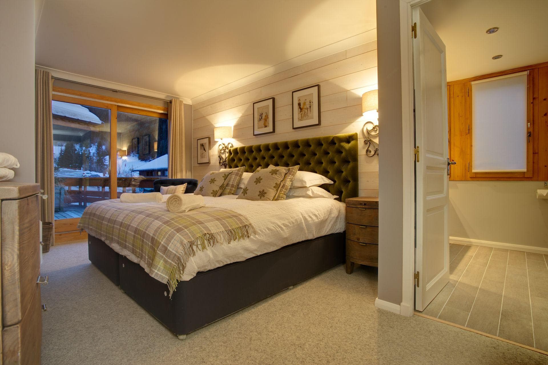 Primary bedroom with king bed and private terrace access