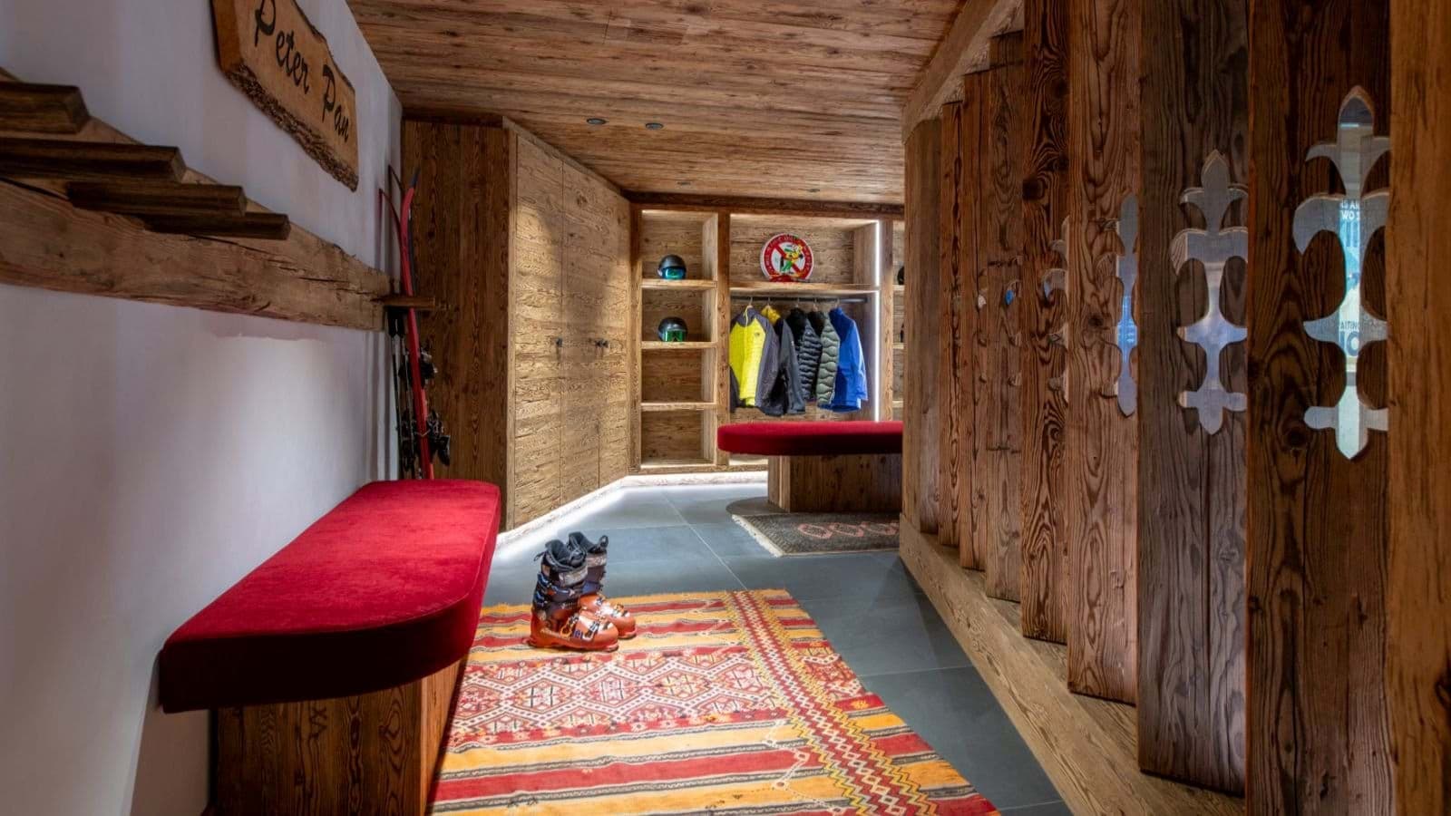 Ski room with bench seating and built-in gear shelving