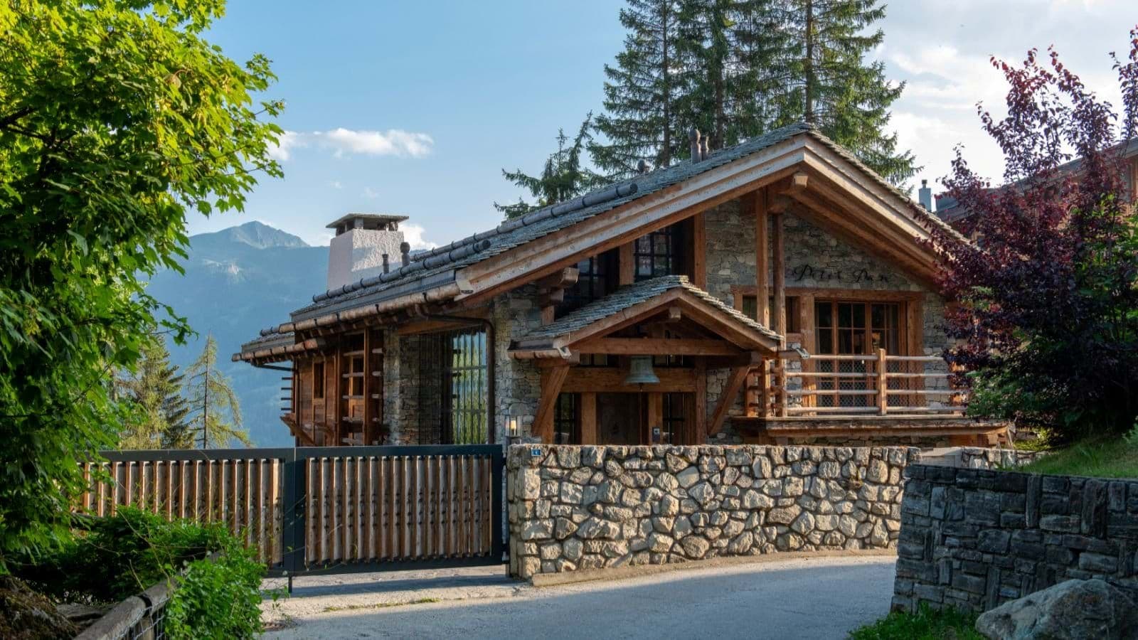 Stone and timber chalet with gated entry and mountain views