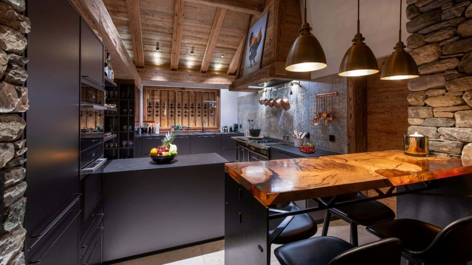 Kitchen with live-edge wood breakfast bar and integrated appliances