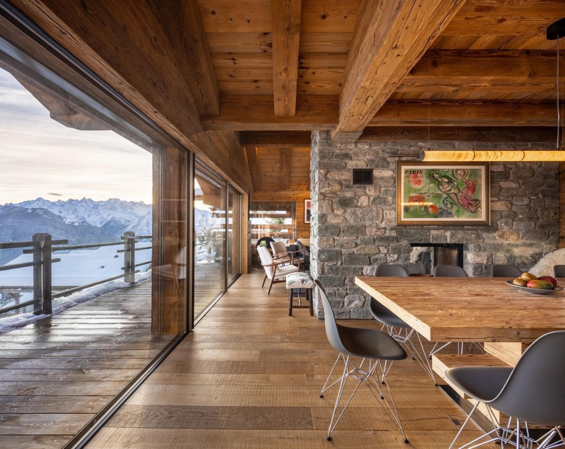 Dining area with floor-to-ceiling windows and panoramic mountain views