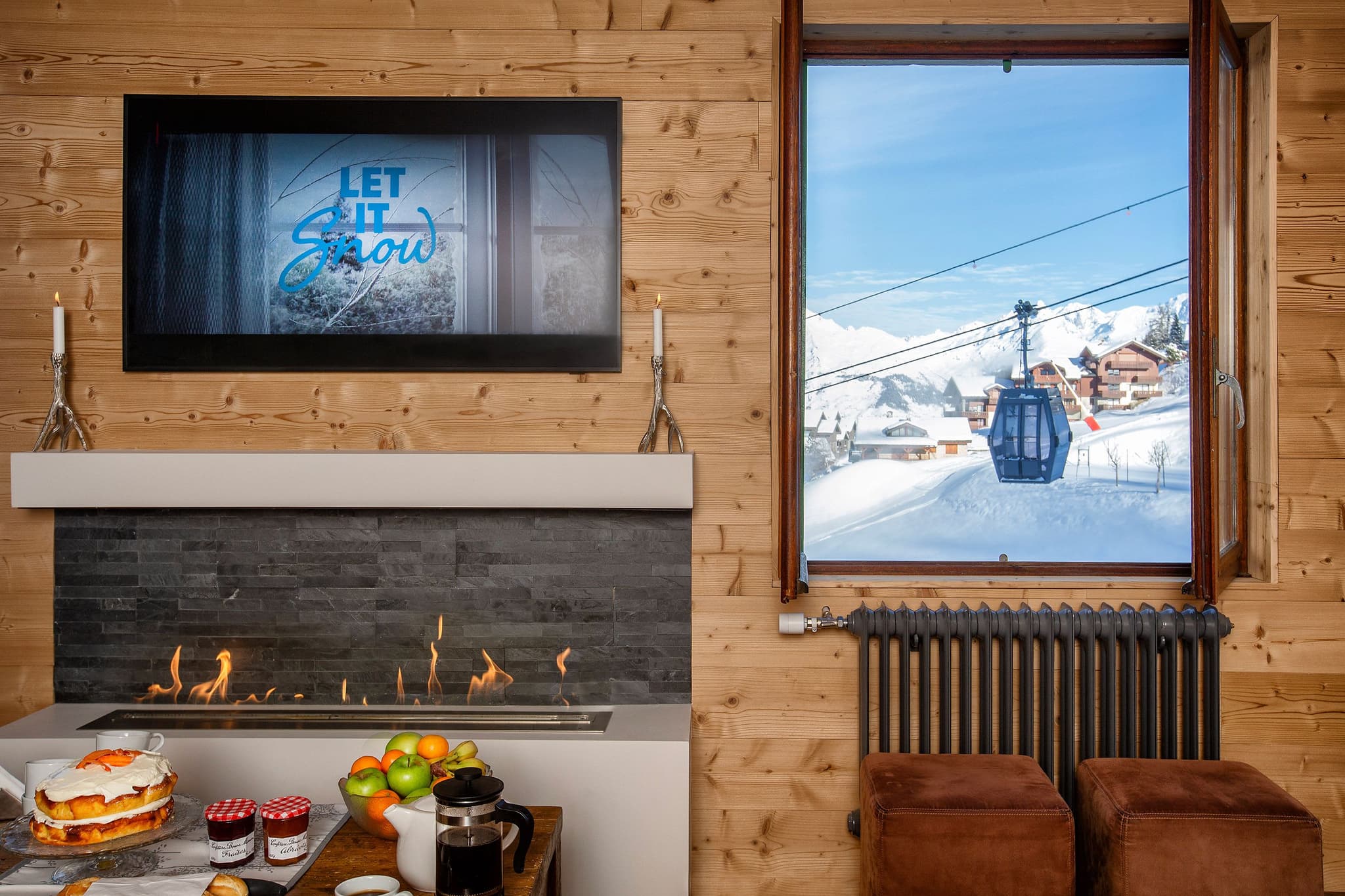 Living area with gas fireplace and views of the ski gondola